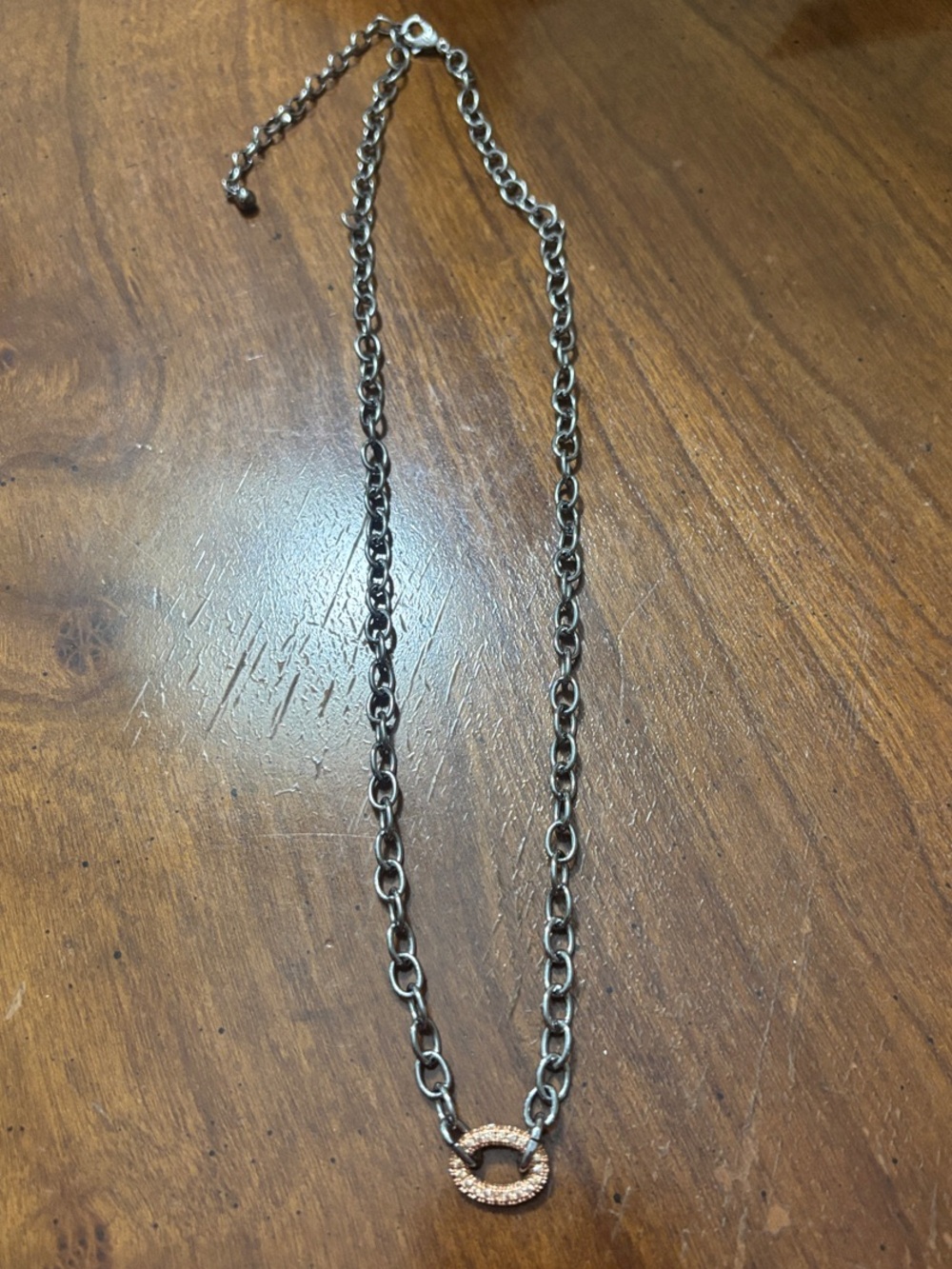 Delicate Oval Rose Gold Link Pendant on gunmetal chain.